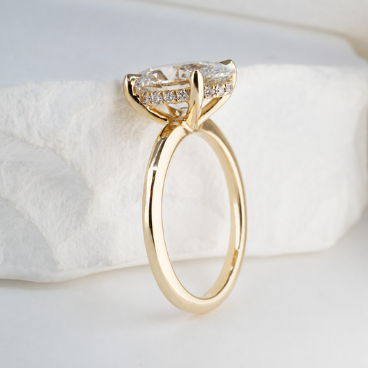 Hidden halo engagement ring with diamonds set beneath the centre stone