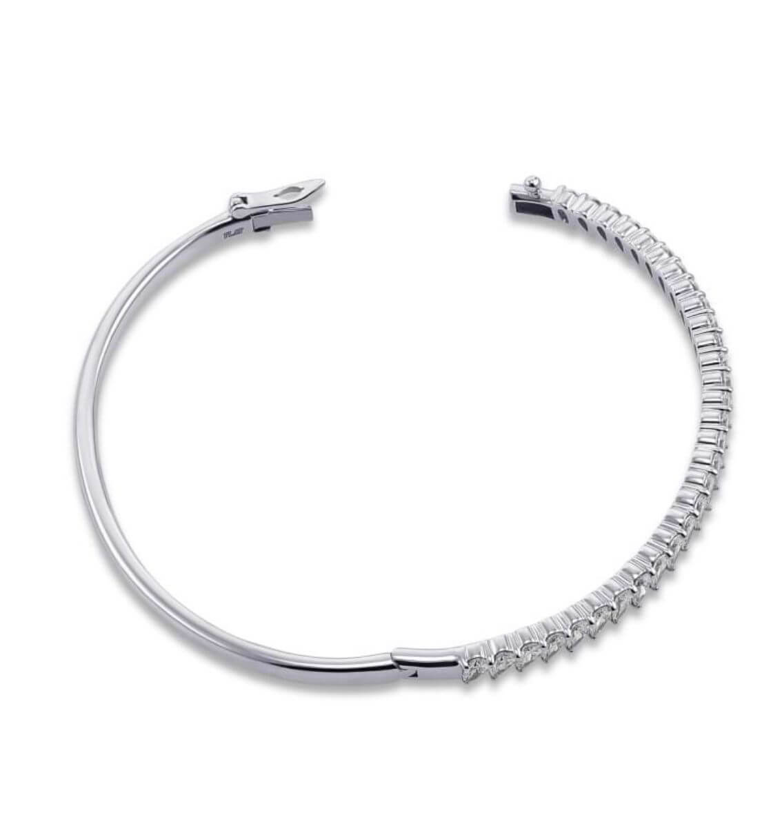Carat House Dubai Raven half tennis bangle with pear-cut diamonds, showcasing elegant jewelry design and sparkling gemstone details.