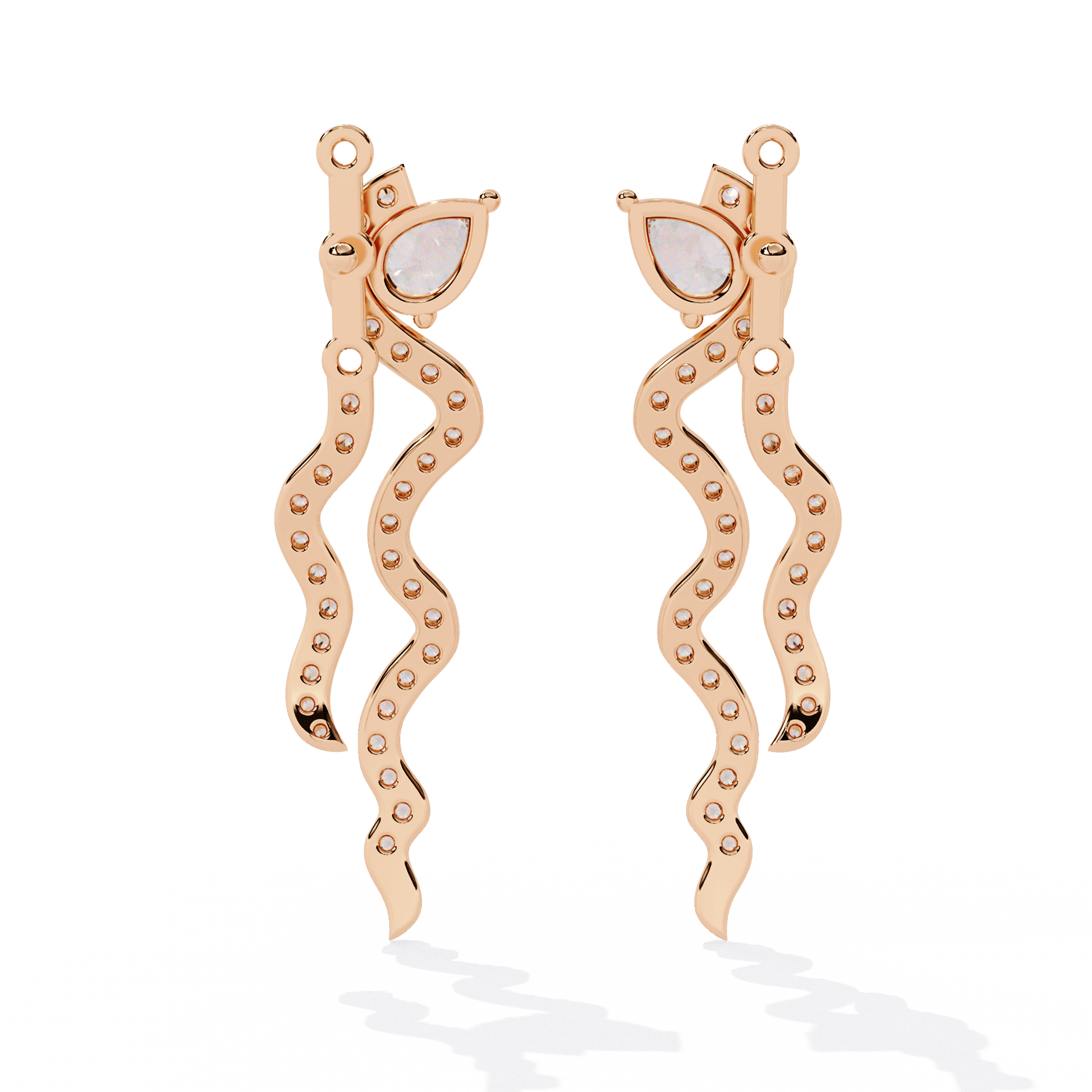 Pear-cut diamond stud earrings with adjustable wave jacket from Carat House Dubai, showcasing elegant jewelry design.