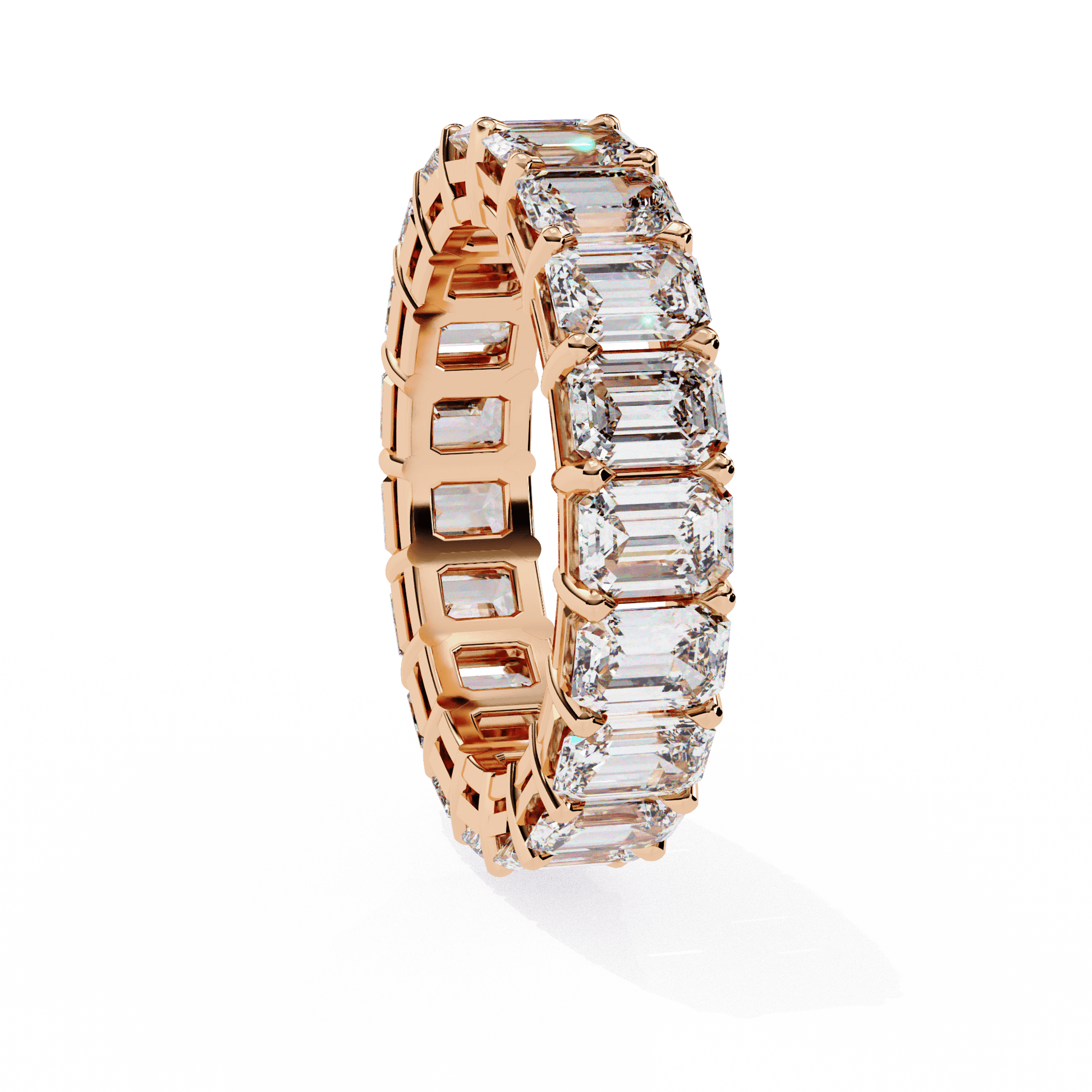 Emerald-cut diamond eternity band by Carat House Dubai featuring a continuous row of sparkling diamonds on a sleek metal band.