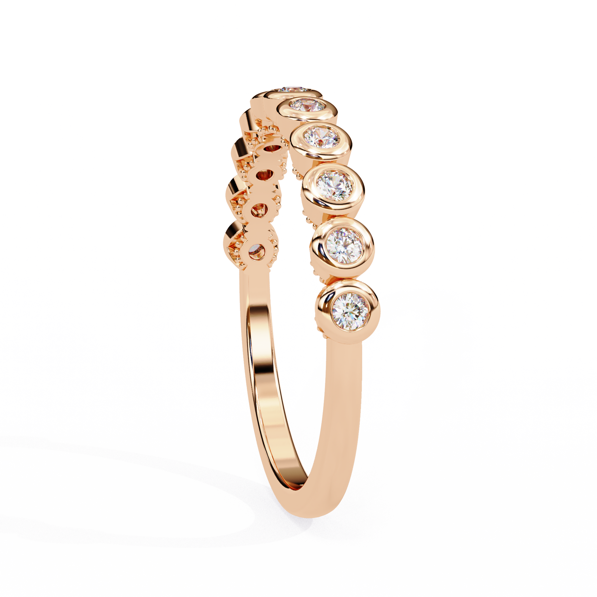 Bezel-set round diamond band by Carat House Dubai featuring sparkling diamonds and sleek gold design.