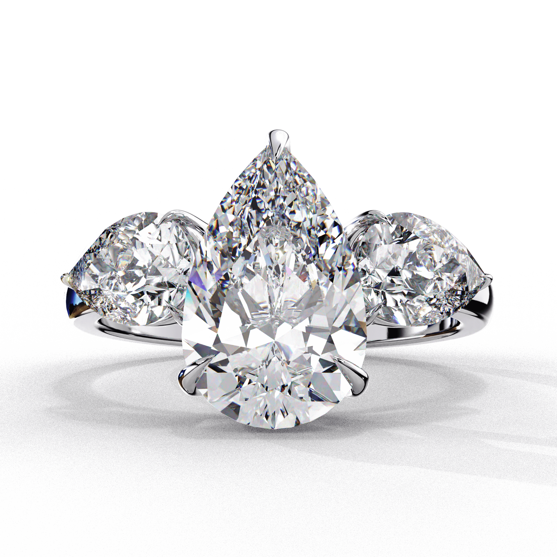 Isabella — Pear cut lab grown and natural diamond engagement ring — trilogy three stone — 18k white gold and platinum — Carat House