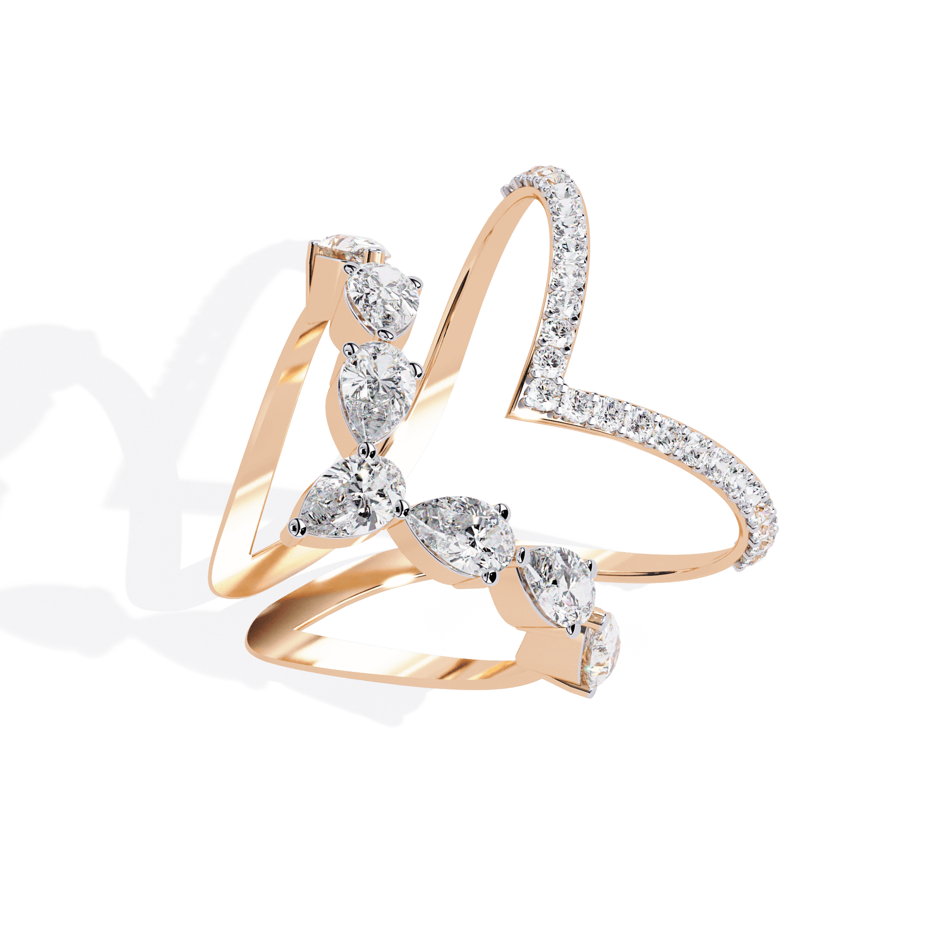 Modern diamond ring featuring open arrow silhouette and pear-shaped stones by Carat House Dubai, showcasing elegant jewelry design.