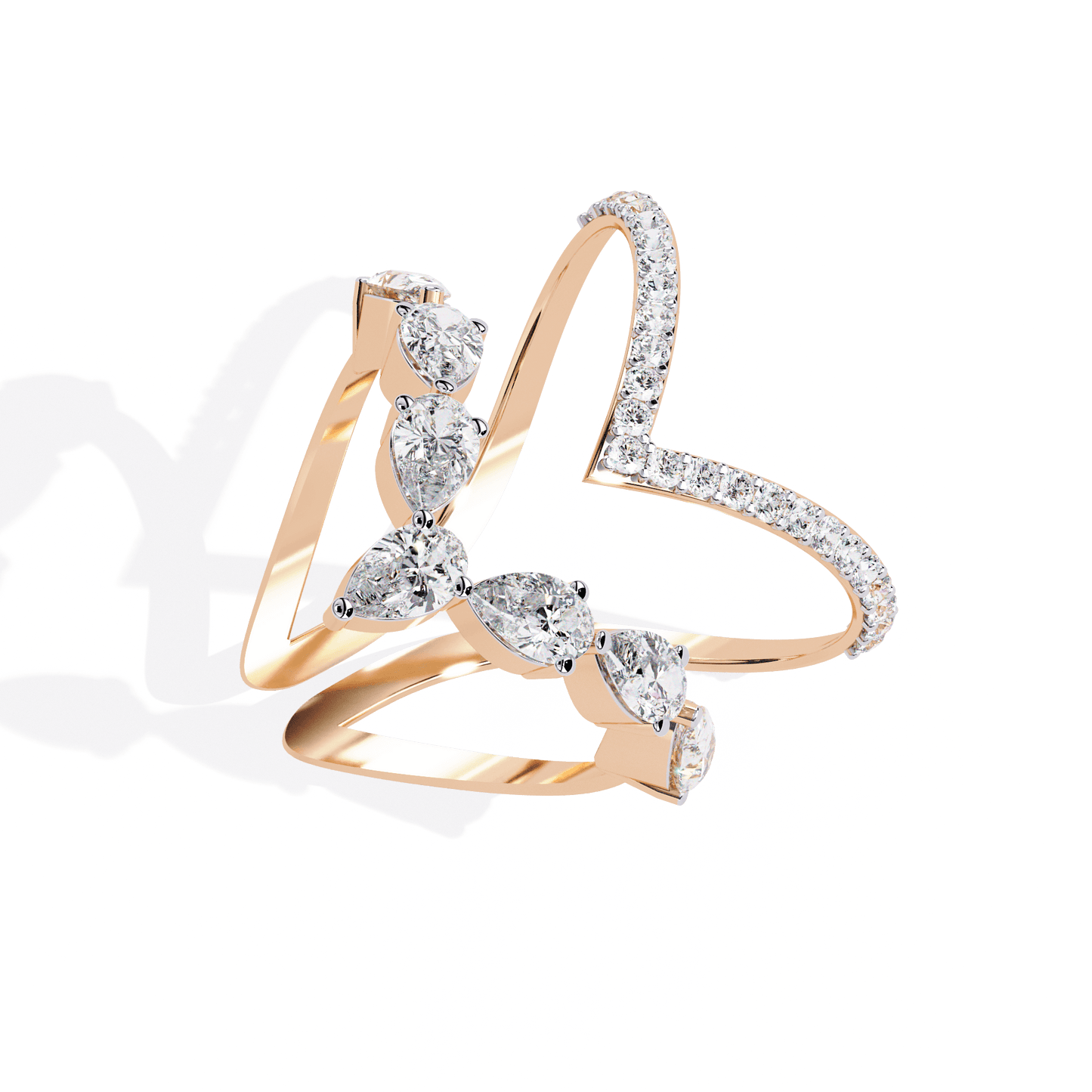 Modern diamond ring featuring open arrow silhouette and pear-shaped stones by Carat House Dubai, showcasing elegant jewelry design.