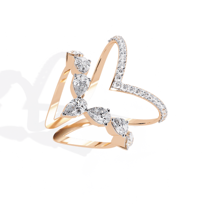 Modern diamond ring featuring open arrow silhouette and pear-shaped stones by Carat House Dubai, showcasing elegant jewelry design.