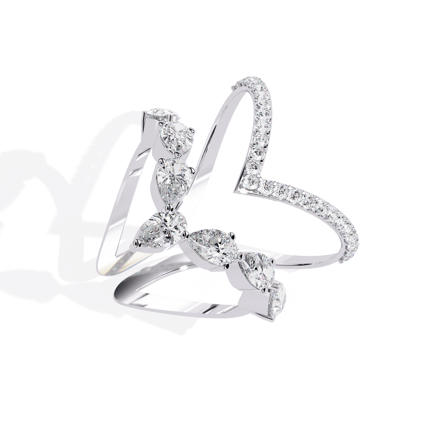 Modern diamond ring by Carat House Dubai featuring an open arrow silhouette and pear-shaped stones.