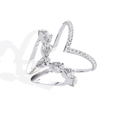 Modern diamond ring by Carat House Dubai featuring an open arrow silhouette and pear-shaped stones.