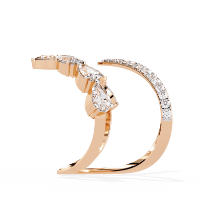 Modern diamond ring by Carat House Dubai featuring an open arrow silhouette and pear-shaped stones.