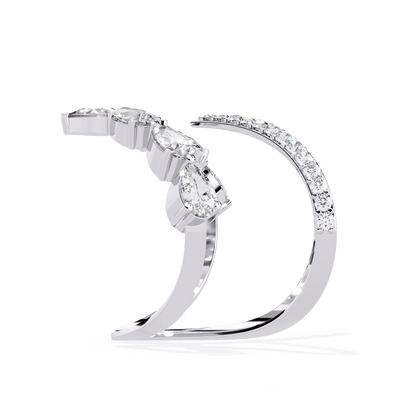 Modern diamond ring by Carat House Dubai featuring open arrow silhouette and pear-shaped stones on a sleek band.