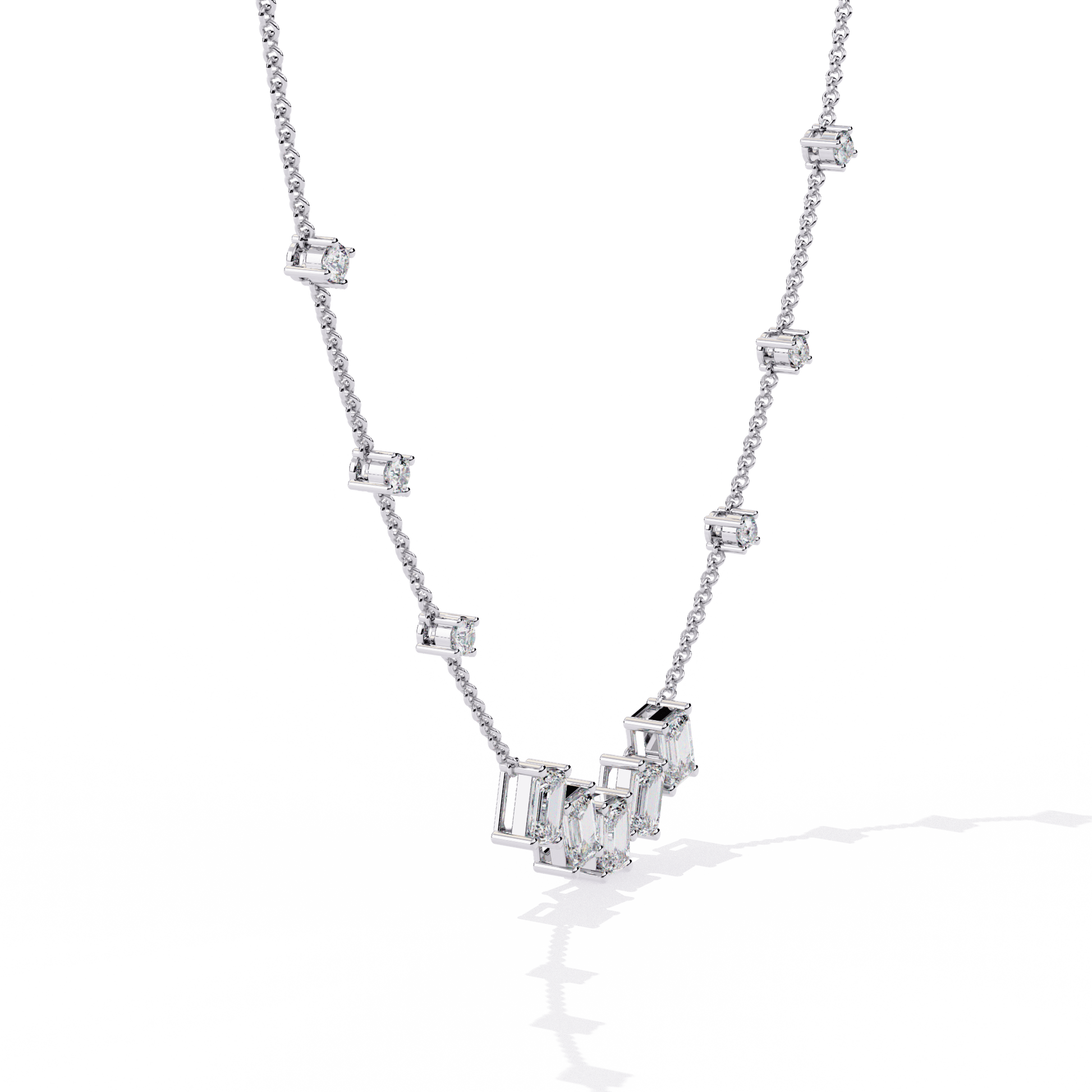 Emerald-cut and round diamond necklace by Carat House Dubai featuring sparkling diamonds on a delicate chain.