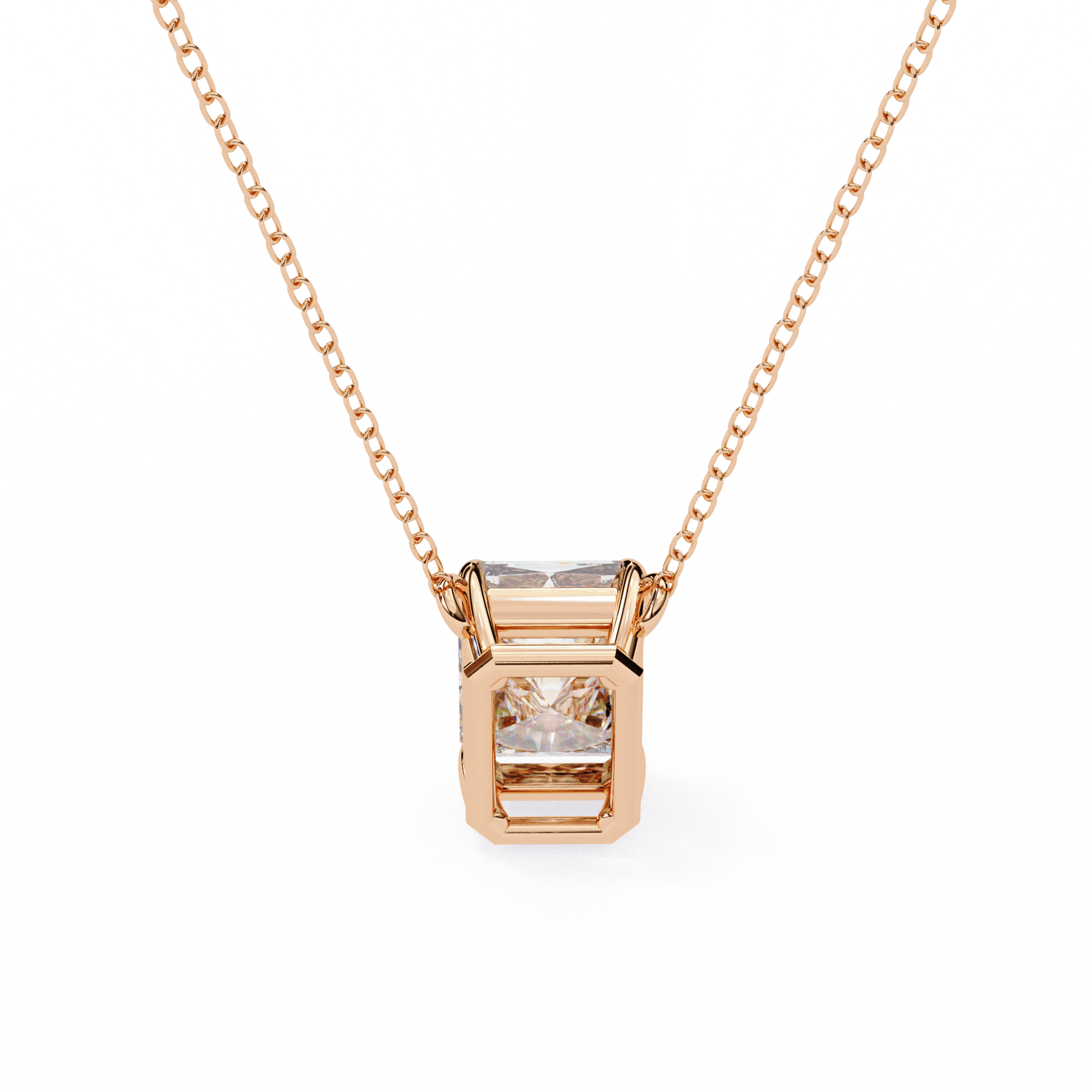 Emerald-cut solitaire pendant by Carat House Dubai featuring a sparkling green gemstone on a delicate chain.