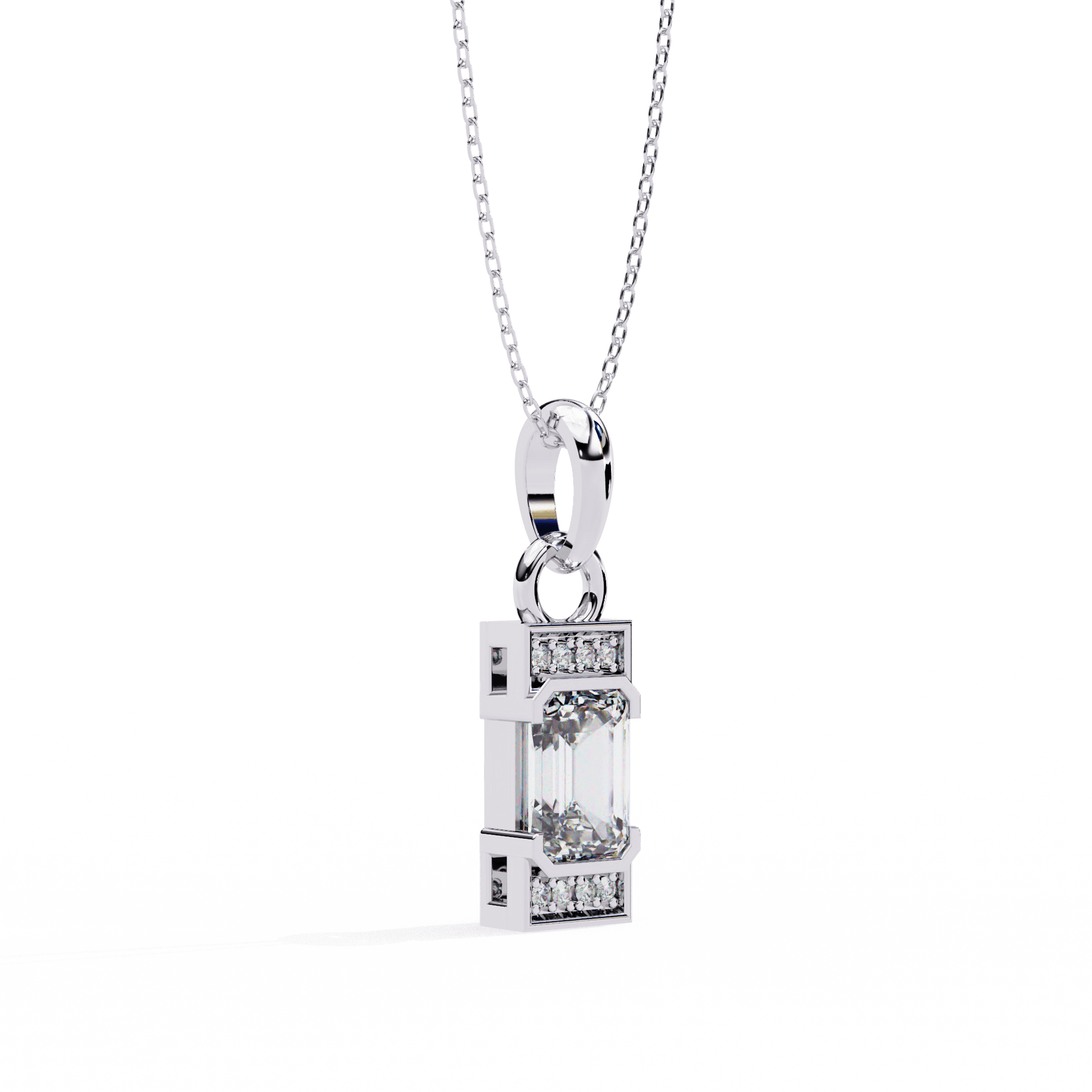 Emerald solitaire pendant with accent diamonds from Carat House Dubai, featuring a vibrant emerald gemstone and sparkling diamond accents.